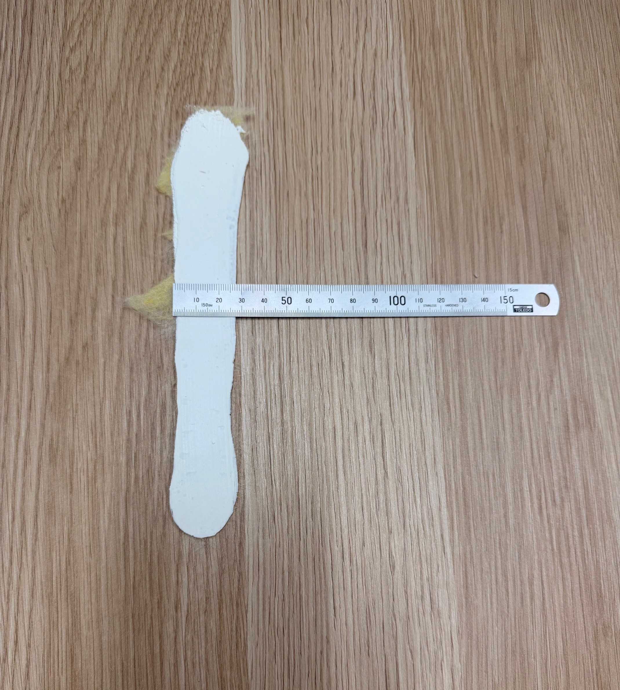 Single bead of adhesive compressed